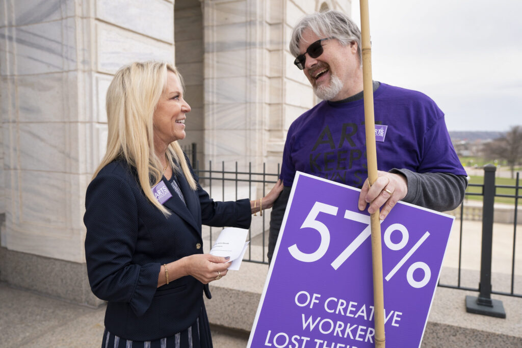 Karin Housley talking with a supporter outside the State Capitol